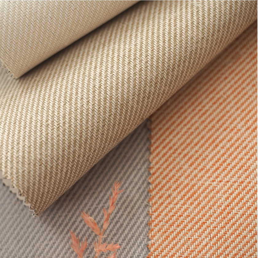 「遮光 淡いカラーの遮光カーテン」の生地アップです。色は単色では無く、2色の糸で織っています。