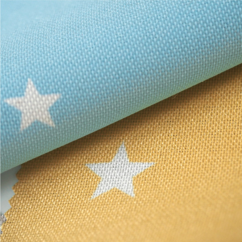 「遮光 北欧星柄の遮光カーテン」の生地アップです。星柄部分は白です。